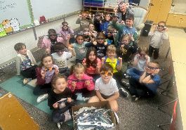  Mrs. Orlando's class shows their solar eclipse glasses collection